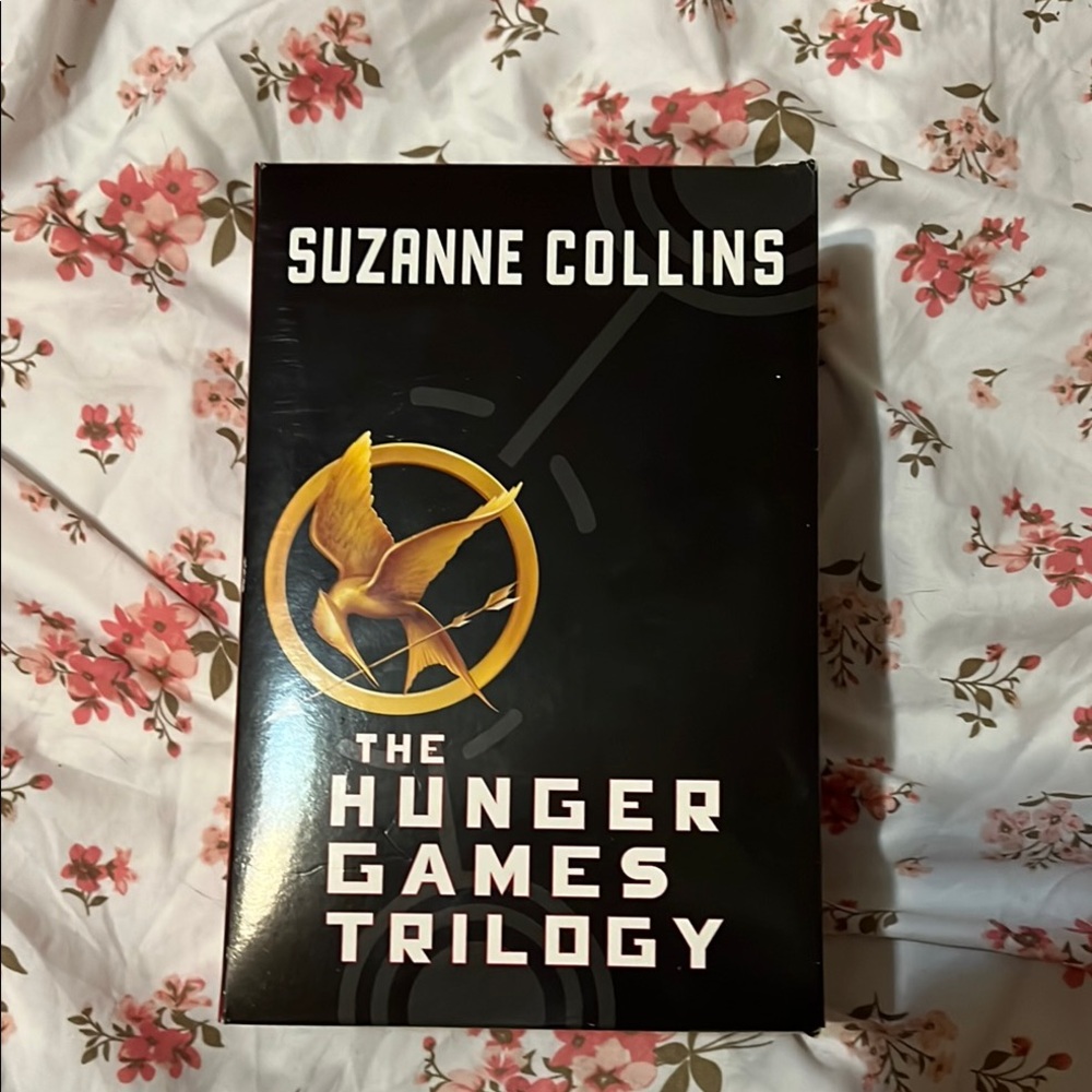 Scholastic Black and Gold Mockingjay Symbol